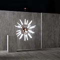 Modern Starburst Chandelier with White Light Fixtures in Minimalist Interior with Concrete Wall