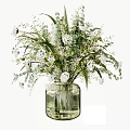 Transparent Glass Vase With White Small Flowers Green Leaves And Ferns Arrangement