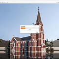 European Church Architecture with Red Brick Tall Spires Clock Tower and Palm Trees Water Reflection