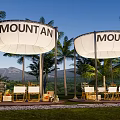 Outdoor Mountain Themed Tents With Palm Trees And Scenic Mountain View Setup