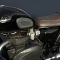 Vintage Black Motorcycle with Brown Leather Seat Round Headlight and Chrome Exhaust