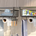 Organized Bathroom Cabinet Rack With Hanging Towels Plates Cleaning Supplies Cups And Toilet Paper Rolls