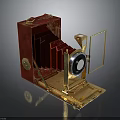 Vintage Red Foldable Camera With Golden Lens And Leather Body Design