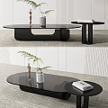 Modern Black Coffee Table With Glass Top And Side Table Decorated With Plant Books Statue