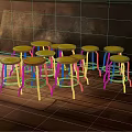 Colorful Bar Stools With Metal Legs Round Seats On Wooden Floor And Warm Wall
