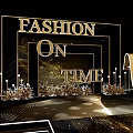 Floral Installation Design For Fashion Event Runway With Decorative Columns And Seating Arrangement