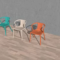 Three Colorful Plastic Leisure Chairs With Backrest And Armrests Against Gray Wall On Wooden Floor