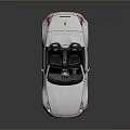 White Modern Convertible Sports Car With Black Soft Top Two Seats And Silver Wheels