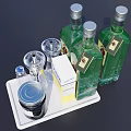 Elegant Green Wine Bottles and Wine Glasses on White Tray with Metal Canister and Box