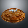 White Drone Placed On Brown Circular Stepped Structure With Layered Design