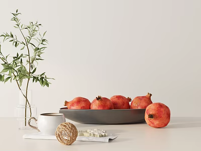 Ceramic Bowl With Fresh Pomegranates And Green Plant On White Kitchen Table 3d model