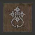 Decorative Metal Door Knocker On Rustic Wooden Panel With Intricate Design