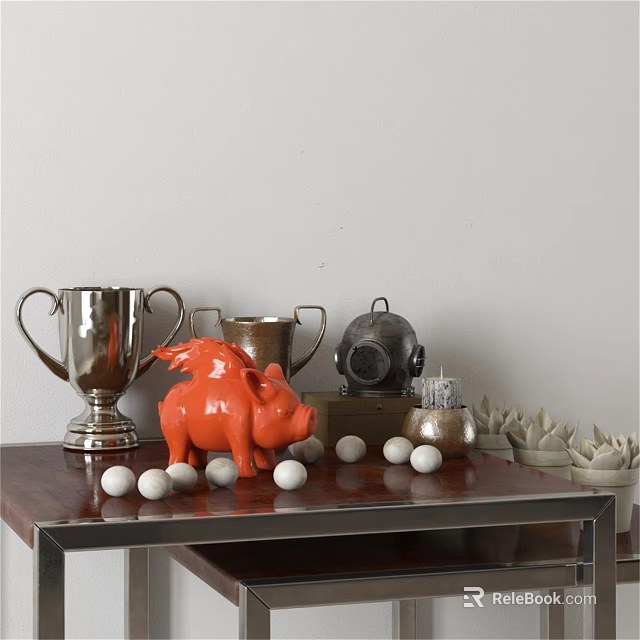 Orange Pig Sculpture with Silver Trophies Black Container White Golf Balls and Succulents on Table 3d model 