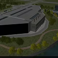 Aerial Planning of Modern Large Public Building With River Greenery Roads and Parking Area