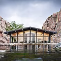 Scenic Guesthouse Building Nestled Between Rocky Cliffs With Large Windows And Water Views