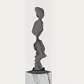 Silver Abstract Sculpture on Marble Base Against Light Colored Wall 3d model