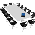 Contemporary White Conference Table With Black Chairs And Laptop On Surface