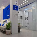 Modern Lounge Area With Comfortable Sofa Green Plants And Glass Partitions