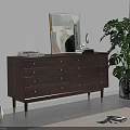 Modern Wooden Chest of Drawers with Golden Handles and Decorative Painting Near Green Plant