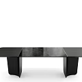 Modern Black Dining Table With Unique Leg Design And Sleek Smooth Surface