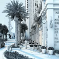 Bustling Commercial Street With Palm Trees Tall Buildings Shops Outdoor Seating And Pedestrians