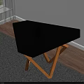 Modern Coffee Table With Black Top And Wooden Cross Legs On Gray Living Room Rug