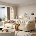 Cozy Living Room With Tufted White Leather Sofa Pillows Brown Blanket And Round Coffee Table