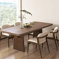 Modern Dining Room With Wooden Table White Cushioned Chairs Green Plant And Fruit