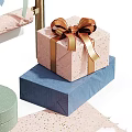 Colorful Gift Boxes With Gold Bows And Hanging Decorative Ribbons Arranged Neatly