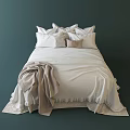 Double Bed with White Sheets and Beige Blanket and Decorative Patterned Pillows for Cozy Bedroom