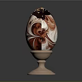 Decorated Chocolate Egg With Red And White Marble Pattern And Gold Sprinkles On Wooden Stand