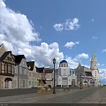 Scenic Commercial Street With Various Architectural Styles Street Lamps Plaza Flower Beds And Blue Sky