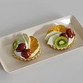 Delicious Fruit Tarts With Kiwi Strawberries And Orange Slices On White Rectangular Tray