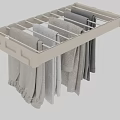 Light Colored Clothes on White Wall Mounted Hanger with Long Sleeve Tops and Pants