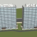 Modern Twin High Rise Residential Buildings With Large Windows And Green Lawns