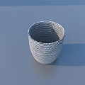 Potted Bonsai Plant with Woven Texture Ceramic Pot and Lush Green Foliage on Blue Background