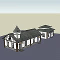 European Style Commercial Complex With Tower Pitched Roof And Stone Walls