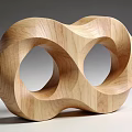 Artistic Wooden Sculpture With Intertwined Double Loops And Smooth Curved Design