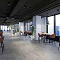 Modern Cafe Interior Design With Wooden Tables Leather Chairs Pendant Lights And Large Windows