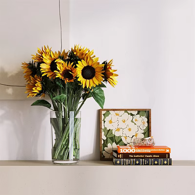 Transparent Glass Vase With Sunflowers And Green Leaves Near Decorative Painting And Books 3d model