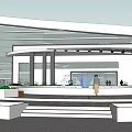 Modern Commercial Complex With Glass Facade Entrance Plaza And Green Landscaping