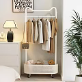Modern Clothes Rack With Hanging Neutral Colored Clothes And Storage Basket In Cozy Bedroom