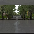 Tranquil Water Fountain In Courtyard With Green Trees And Building Reflections