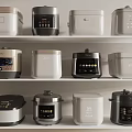 Various Styles of Rice Cookers and Pressure Cookers on White Kitchen Shelves with Digital Panels
