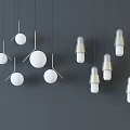 Modern Pendant Lights With Various Designs Hanging And Illuminated On Grey Background