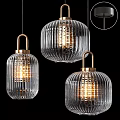 Three Modern Ribbed Glass Pendant Lights With Golden Metal Frames And Warm Glow