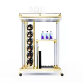 Golden Bar Cart With Wine Glasses Bottles Drinks And Wheels On Shelves