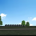 Garden Ornaments Featuring Glass Greenhouse Structures Along Road Under Blue Sky