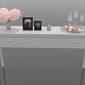 White Console Table With Pink Flower Bouquet Photo Frames Decorative Tray And Small Ornaments