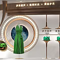 Elegant Luxury Hermes Shop Window Display With Green Dress And Green Items On Display Stands